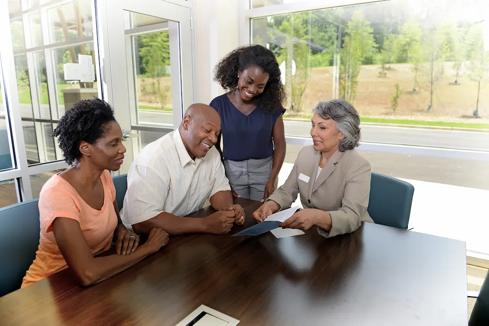 Group of people discussing a document